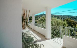 a balcony with a view of the mountains at DOMO MARE E TERRA Boutique Rooms and Spa in Posada