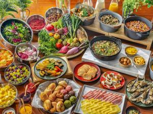 a table topped with lots of different types of food at LACER SUITES KAMAKURA -formerly kamakura seizan- in Kamakura