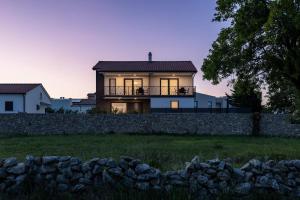 a house on top of a stone wall at Luxury-relax residence Muraj in Kornić