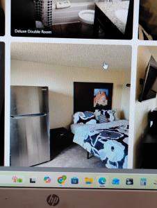 a model of a bedroom with a bed and a refrigerator at The suite in Rapid City