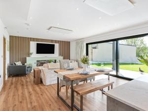 a living room with a table and a couch at Brynor Lodge in Great Torrington