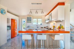 A kitchen or kitchenette at Legrena Beach Villa