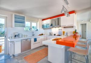 A kitchen or kitchenette at Legrena Beach Villa