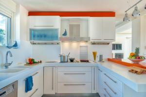 A kitchen or kitchenette at Legrena Beach Villa