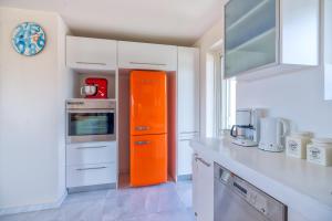 A kitchen or kitchenette at Legrena Beach Villa