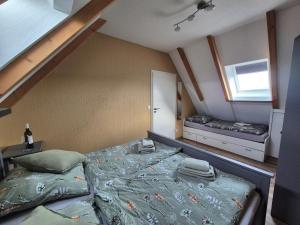 a bedroom with a large bed and a window at Weinbleibe Weingut Beyer in Dorndorf