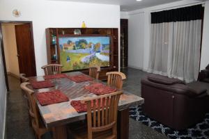 a living room with a dining table and a television at Nature Park villa in Arambegama