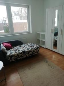 a living room with a couch and a window at lichtdurchflutete 2 Zimmer Wohnung in Dinslaken