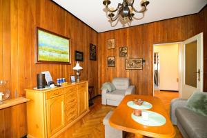 a living room with a couch and a table at City Stay Kaszownik AC Progres in Toruń +14 photos