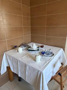 a table with a white table cloth on it at Lac 2 Tunisi in El Aouina Station +1 photo