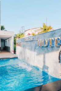 a pool at a hotel with a water slide at Zogaj Hotel in Ksamil