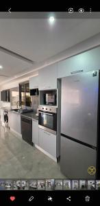 a large kitchen with stainless steel appliances at Luxury Prestige Villa in Midoun