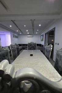 a conference room with a table and chairs at Luxury Prestige Villa in Midoun +21 photos
