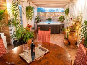 a table with two wine glasses on top of it at FalcoBianco GuestHouse in Montefalco