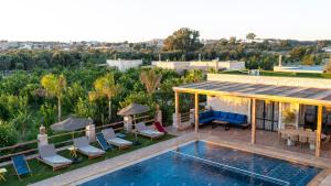 an aerial view of a villa with a swimming pool at Dar Eddihi Essaouira in Essaouira