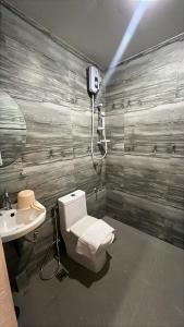 a bathroom with a toilet and a sink at Stayhere Boracay Hostel in Boracay +21 photos