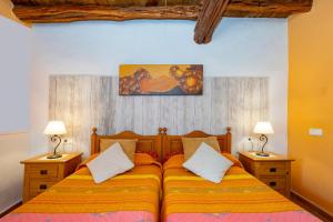 a bedroom with a bed with two lamps on both sides at CANA MARINA Family Friendly in Santa Eularia des Riu +37 photos