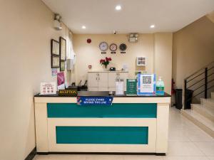 a lobby with a counter in a store at Obrero Suites Davao in Davao City