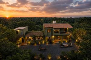 an aerial view of a house at sunset at Gir Wildtrack Lodge - Into the Deep Forest in Sasan Gir