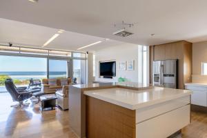 a kitchen and living room with a view of the ocean at Number 10 I Private Properties in Dunsborough +23 photos
