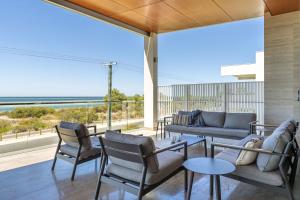 a living room with a view of the ocean at Number 10 I Private Properties in Dunsborough