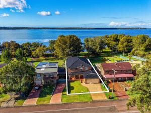 an aerial view of a house with a lake at Panorama Shores in Lakeside