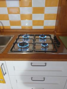 a stove top oven sitting on top of a kitchen counter at Dimora Li Vinti in Cicciano +2 photos