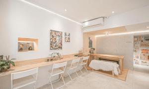 a kitchen with a table and chairs in a room at Pohang Villa Dahlia in Pohang