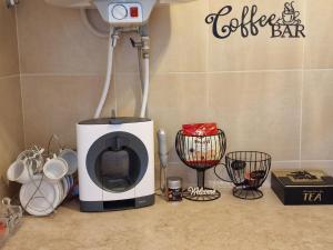 a coffee maker sitting on top of a counter at Z-apartment in Tryavna in Tryavna