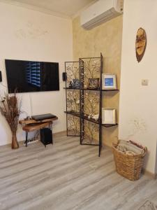 a living room with a television and a table at Z-apartment in Tryavna in Tryavna