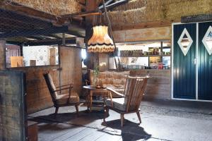 a dining room with a table and two chairs at Smuk Bell Tent Glamping nabij het water in Friesland in Echtenerbrug