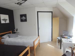 a bedroom with a bed and a table and a desk at Abbaye de Belval in Troisvaux +32 photos