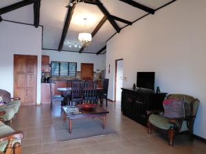 a living room with a couch and a table at Sickle Bush Da Gama Lake in White River