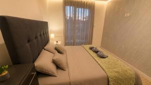 a bedroom with a large bed with two pillows at Luxury Apartment Paraćin - River View in Paraćin