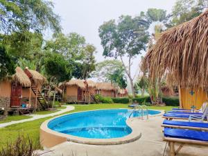 a resort with a swimming pool and a yard at The Countryside Pai in Pai