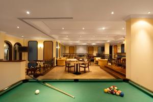 a billiard room with a pool table at Al Falaj Hotel - Secure City Escape in Muscat in Muscat