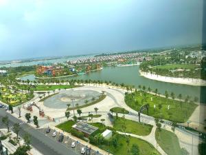 an aerial view of a park next to a river at 1BR Olive & Rouge House in Long Bình
