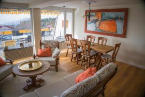 a living room with a table and a dining room at Ihre exklusive Auszeit im Allgäu in Scheidegg