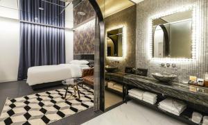 a bathroom with two sinks and a large mirror at Incheon Guwol Hotel Bay 204 in Incheon
