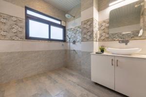 a bathroom with a sink and a mirror at A Mountains Suffer Hotel Kasauli Near Kasauli Hills Resort by Splendid Retreat Hotels - Family Groups - Balcony - Parking - Mountain View - River View - Forest Treks - Vacation - Memories in Kasauli