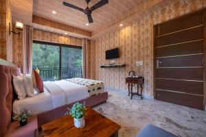 a bedroom with a bed and a large window at A Mountains Suffer Hotel Kasauli Near Kasauli Hills Resort by Splendid Retreat Hotels - Family Groups - Balcony - Parking - Mountain View - River View - Forest Treks - Vacation - Memories in Kasauli +10 photos