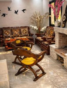 a living room with a couch and a chair at Moussaoui house in Aïn Draham