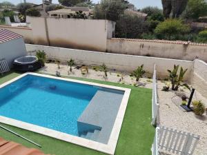 a swimming pool in the backyard of a house at Villa Ohana in Syracuse