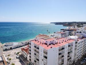 an aerial view of a building next to the ocean at Timeless Beach V - Apartment in Armação de Pêra
