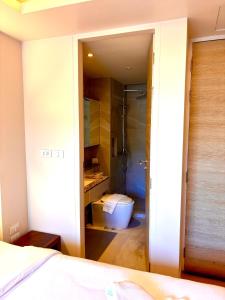 a bathroom with a shower and a toilet in a room at Adventure Studio Aonang in Ao Nang Beach