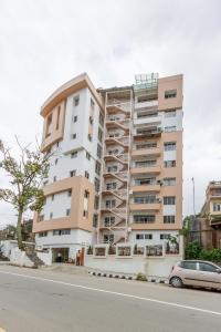 a tall apartment building on the side of a street at Retreat Serviced Apartment in Kathmandu