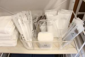 a drawer filled with white utensils and other items at 2026APR NEW Open! SETOUCHI BLUE BASE in Utazu