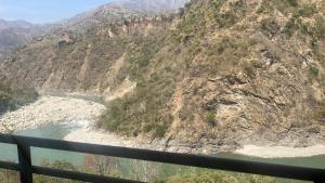 a view of a mountain with a river in it at Beas Zayaka - Hotel & Cafe in Pāndoh