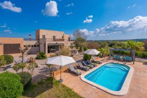 an overhead view of a pool with chairs and umbrellas at Son Vigili in Campos