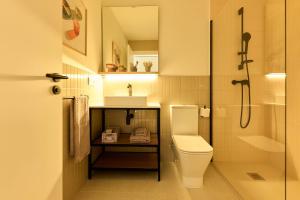 a bathroom with a toilet and a sink and a shower at Be Casa Sant Cugat in Sant Cugat del Vallès +32 photos